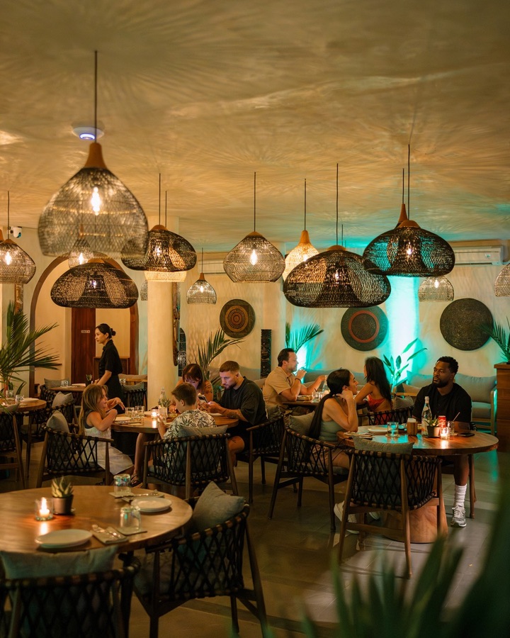 Warmly lit dining room at Té Kila